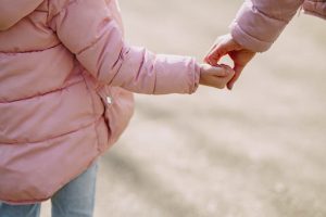 Stress and Recovery from Addiction Close up of young girl holding someone's hand